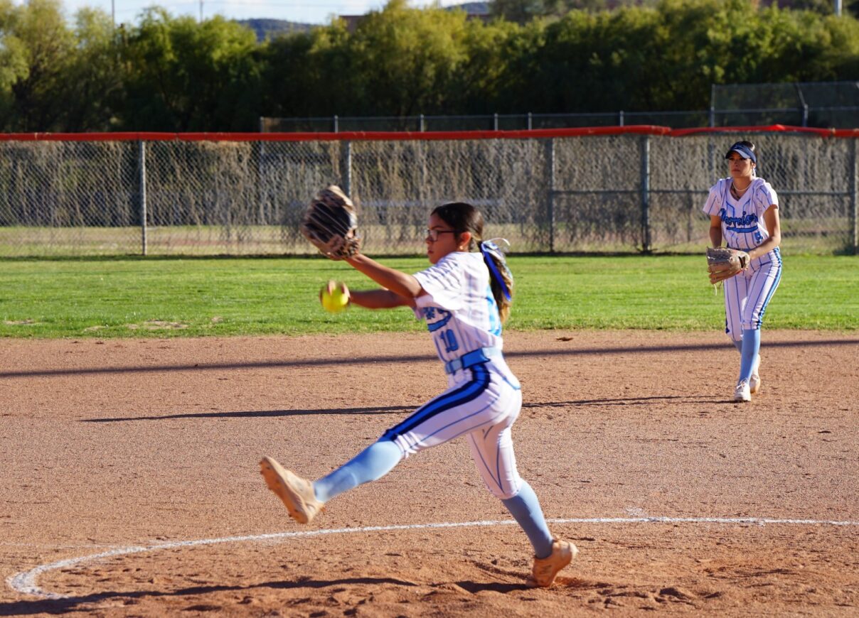 A Pueblo softball player prepares to pitch