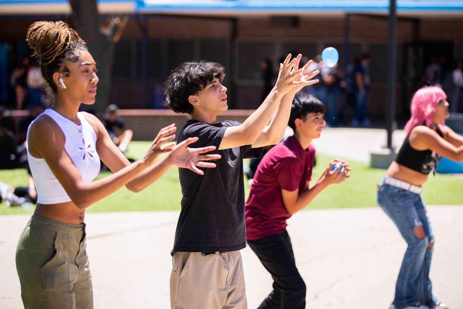 Pueblo High School students play with water balloons on the first day.