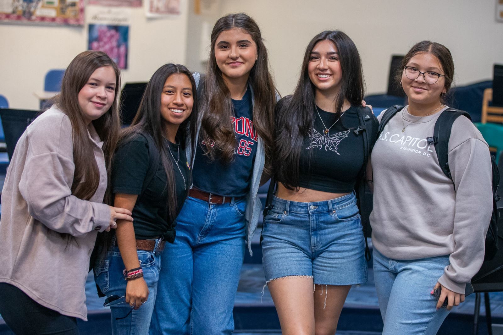 A group of female students are excited for the first day of school at Pueblo High School.
