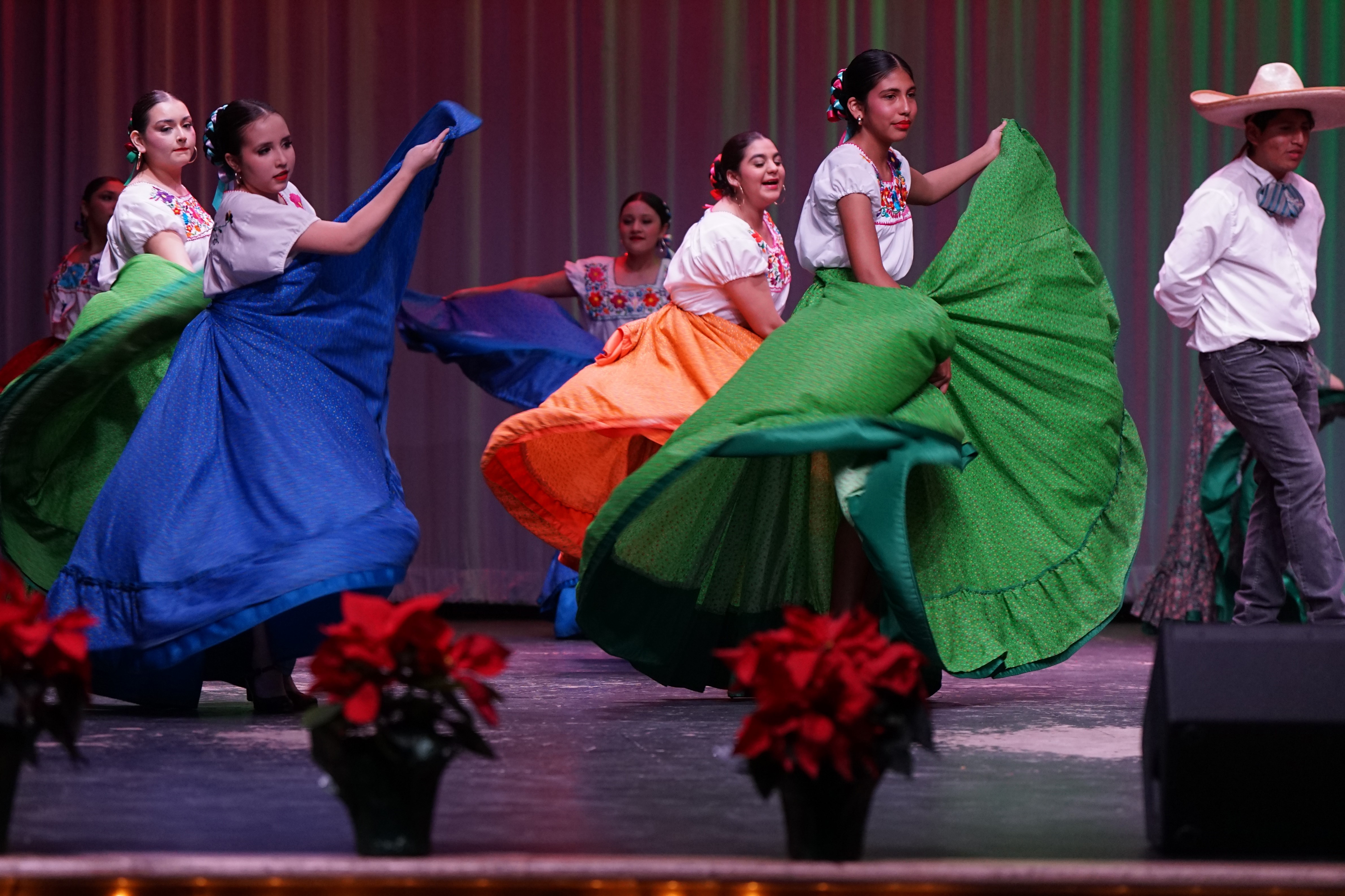 Girls dance in their colorful folklorico dresses