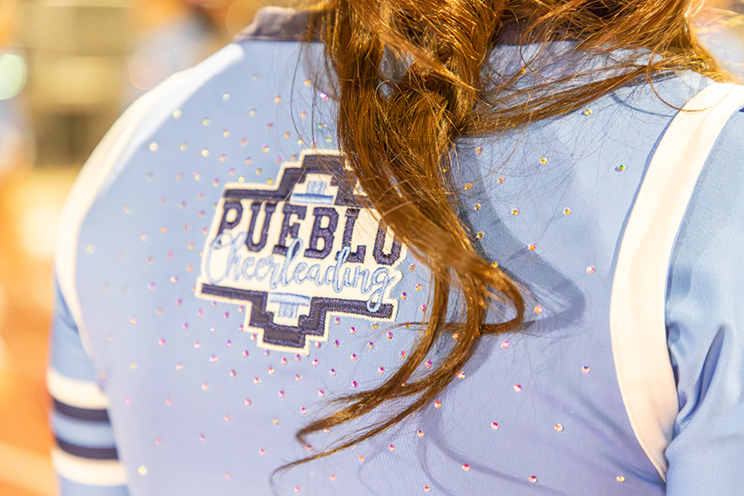 Closeup of the back of the Pueblo Cheerleading uniform