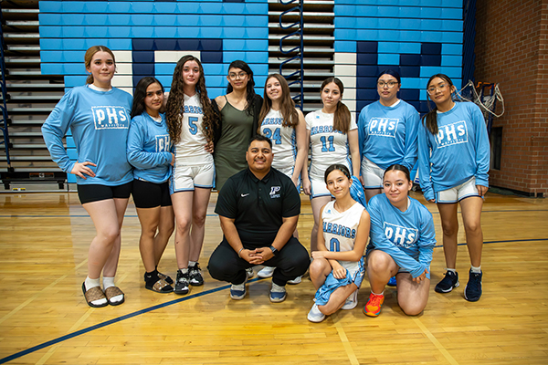 The Pueblo girls basketball team group photo