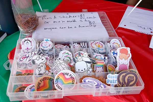 A collection of pins and stickers for sale