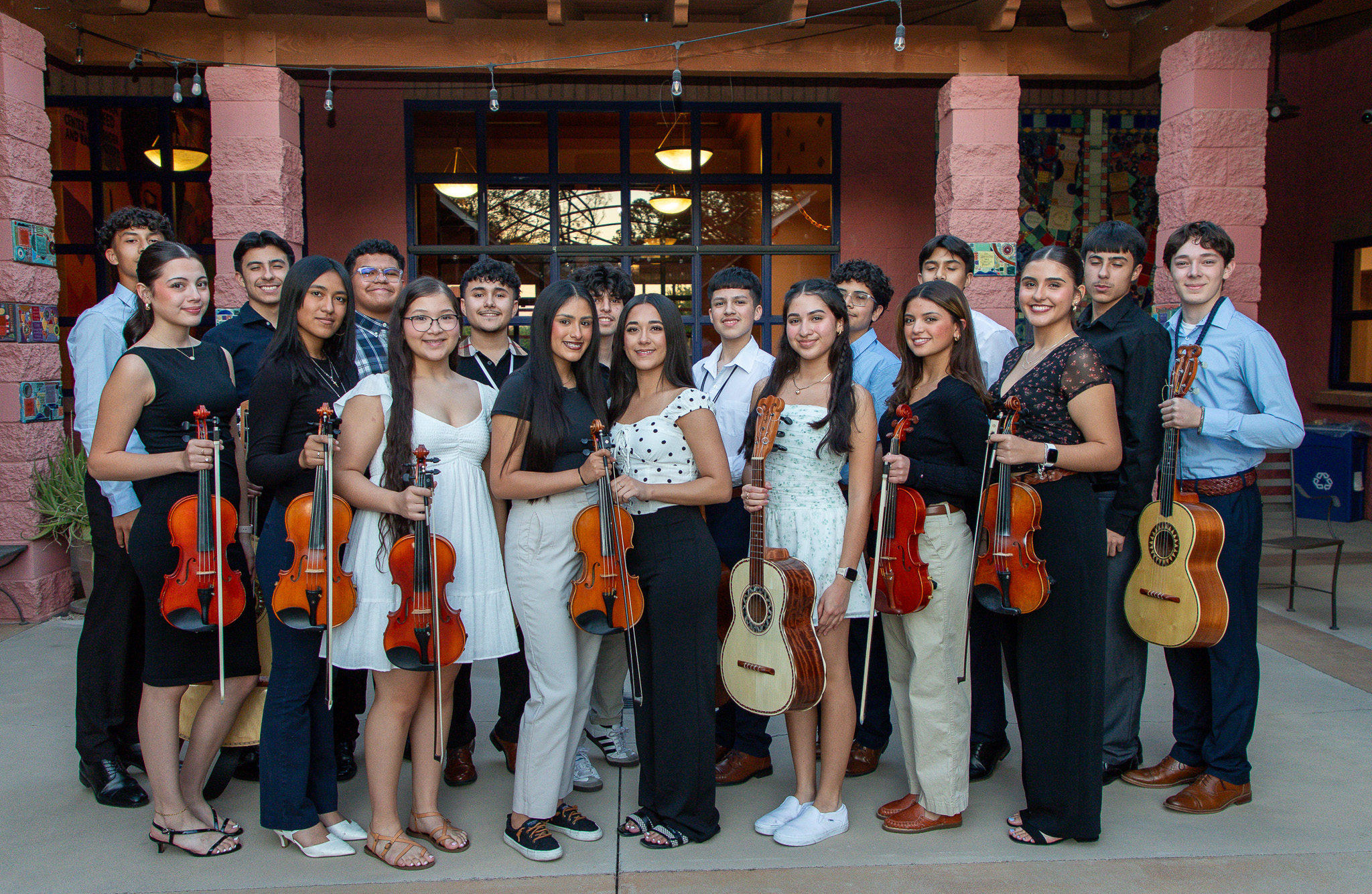Mariachi Aztlan group poses with their instruments