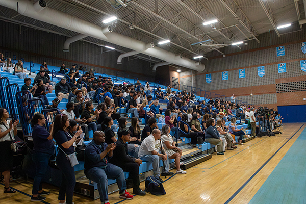 Friends and family sit in the bleachers during Signing Day