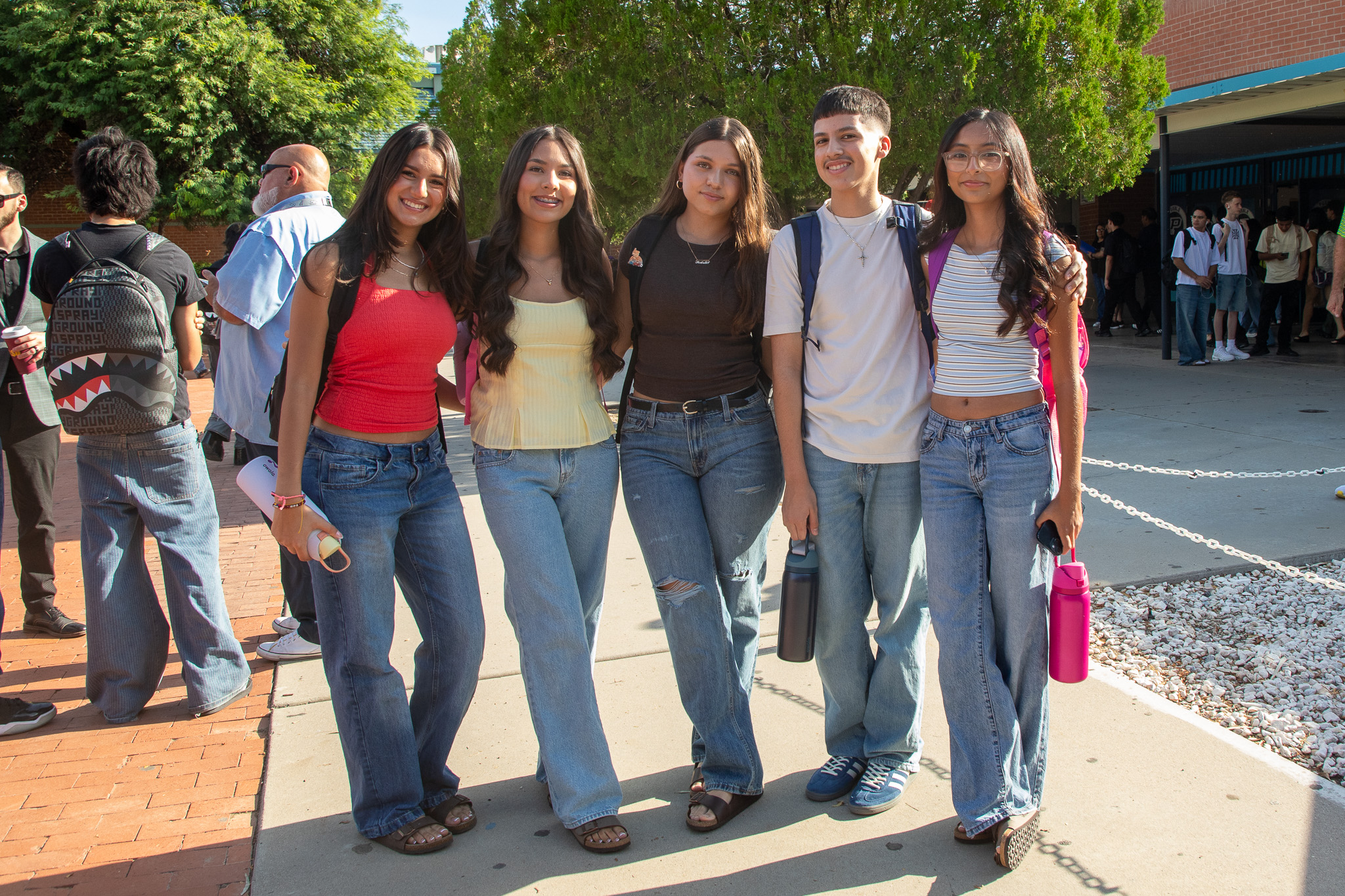 A group of friends pose outside Pueblo HS on the first day