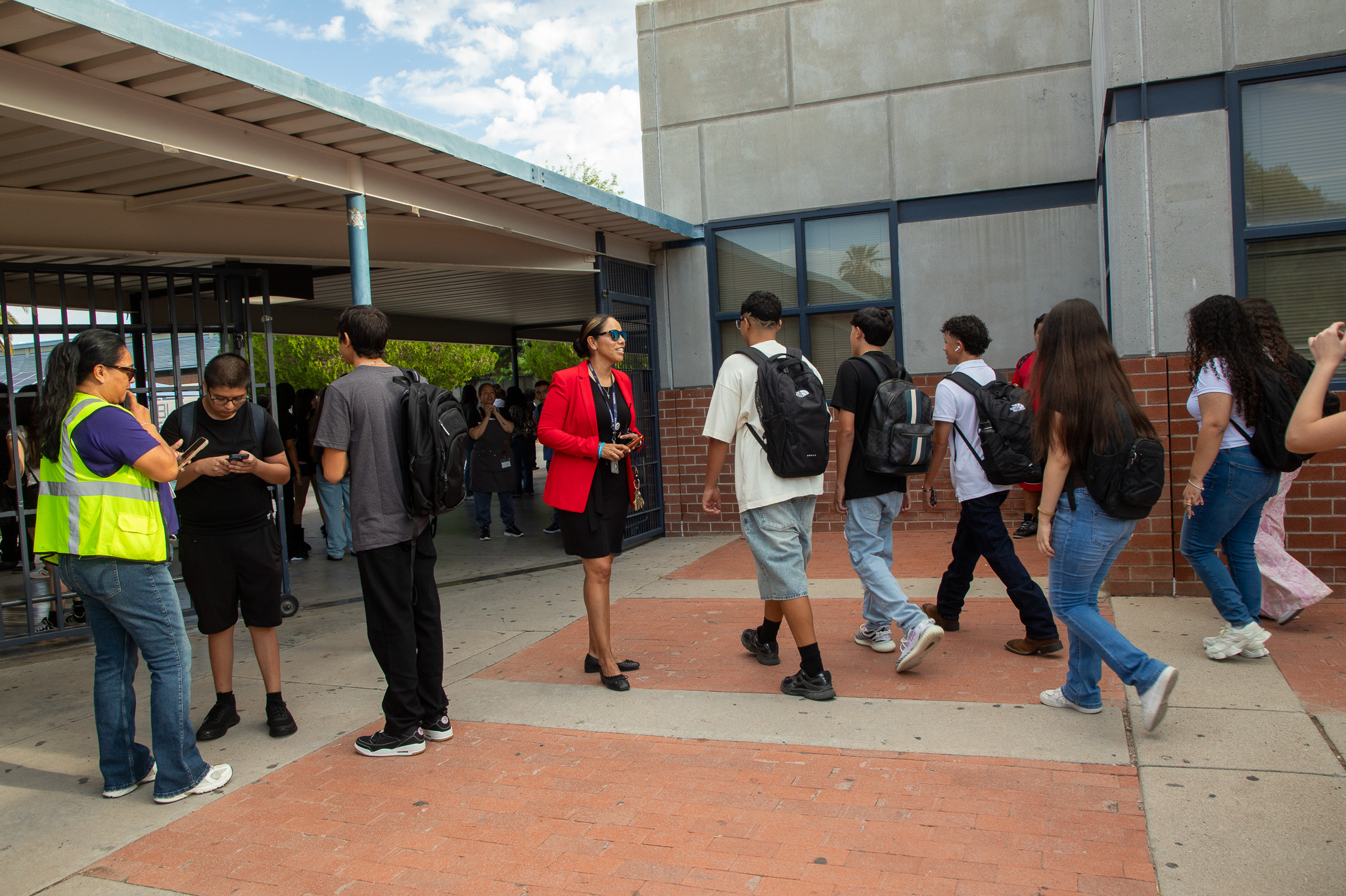 Students and staff walk around campus on the first day